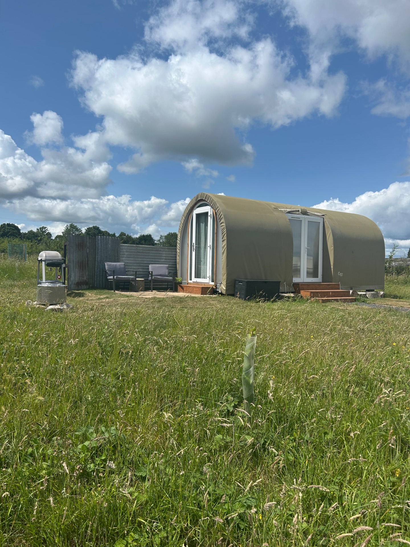 Exterior of French camping Pod Coco with private firepit & BBQ