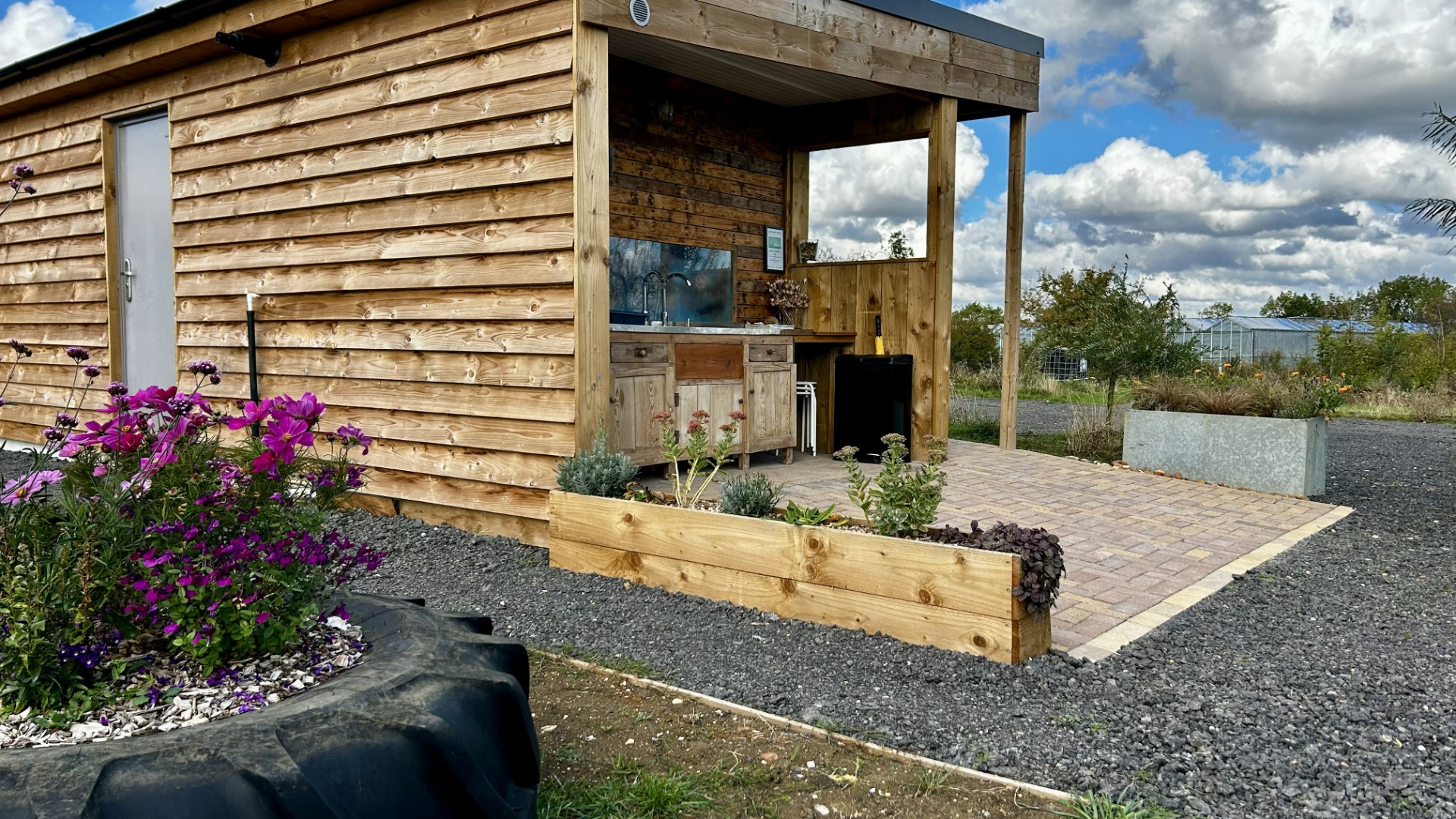 Washing up area with modern sensor taps and washing up liquid. 